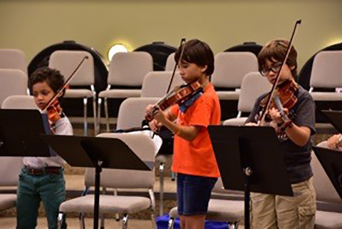 Students playing instruments at the Frost School of Music
